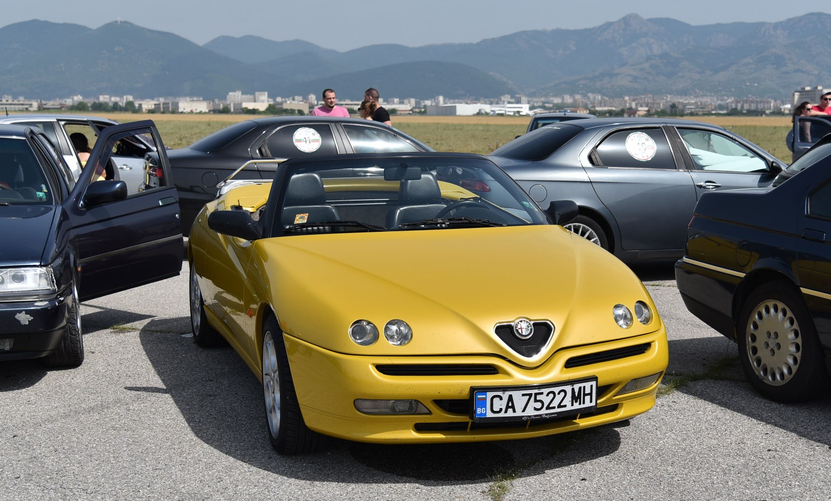 Yellow convertible with distinctive round headlights and open top