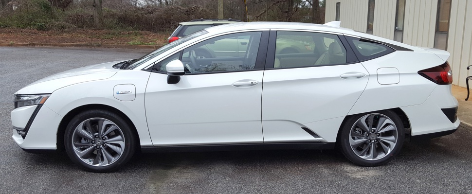 White 2017 sedan side profile with aerodynamic design and alloy wheels