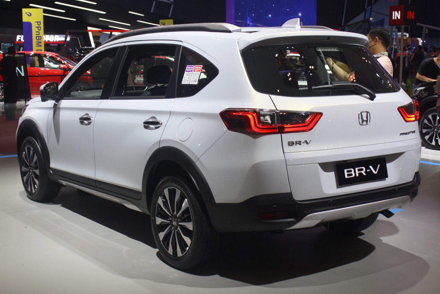 Rear and side view of a white modern SUV with LED taillights and alloy wheels