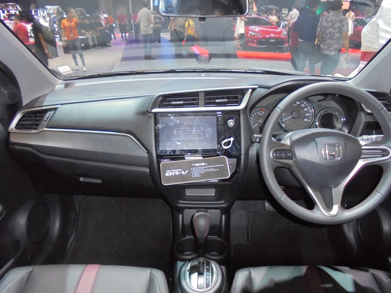 Dashboard, steering wheel with controls, and center console with touchscreen display