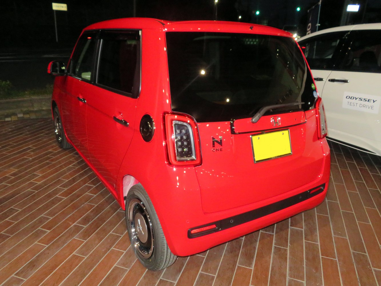 Rear side view of compact boxy hatchback with distinctive tail lights