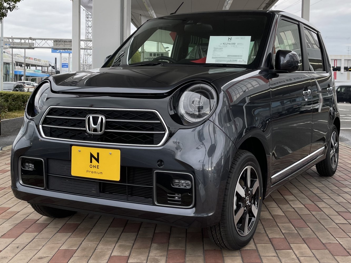 Front view with round LED headlights and hexagonal grille