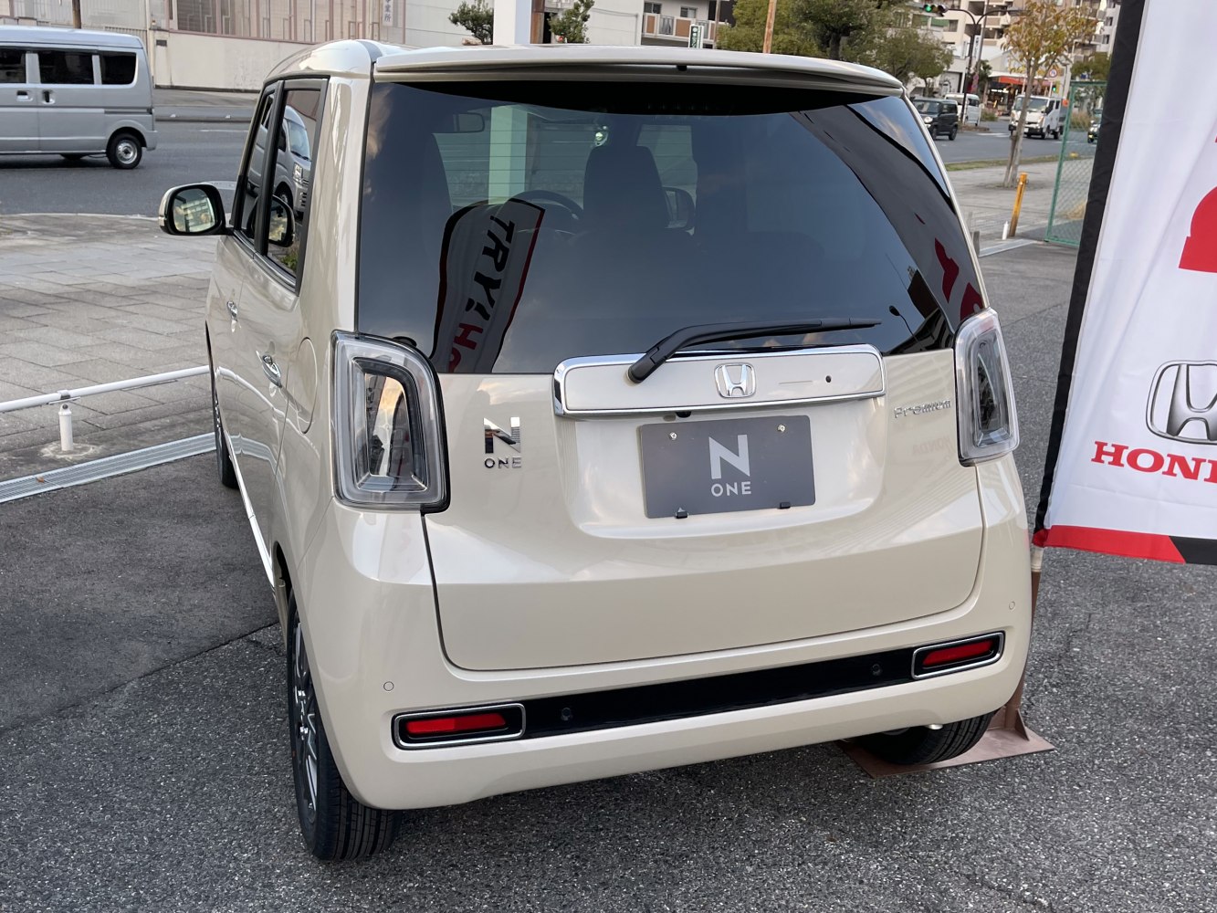 Rear view of compact hatchback with modern tail lights and rear window wiper