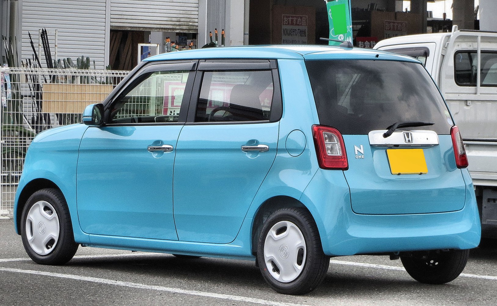 Compact hatchback with retro design and unique rear light clusters
