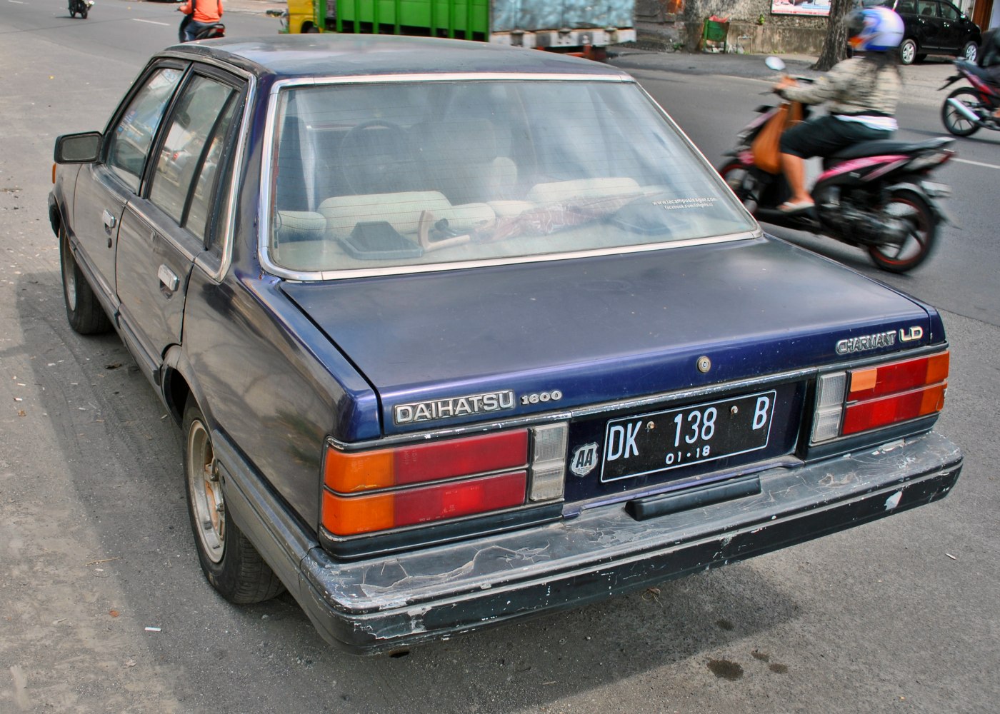 Rear exterior with taillights and badge emblems of a vintage sedan