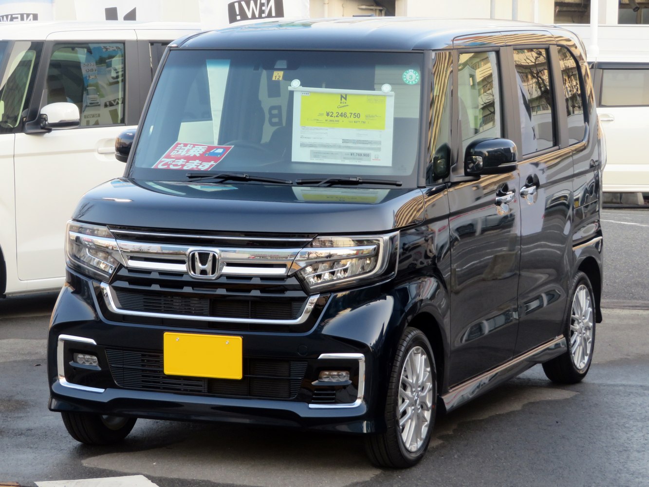 Boxy compact vehicle front with LED headlights and chrome grille