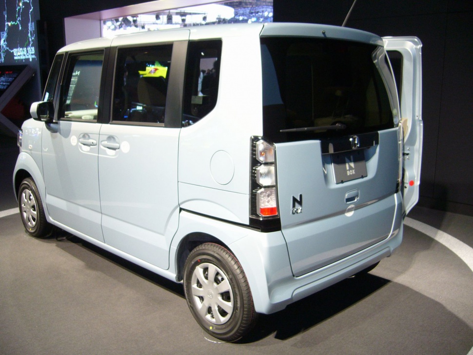 Boxy kei car rear with vertical tail lights and open rear door