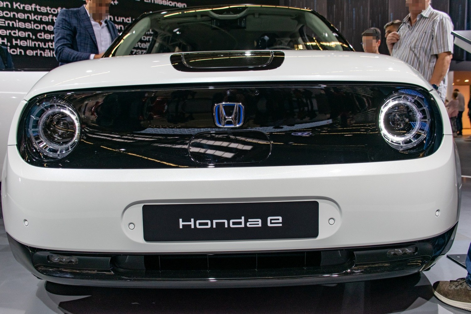 Front view with round LED headlights and black-white design