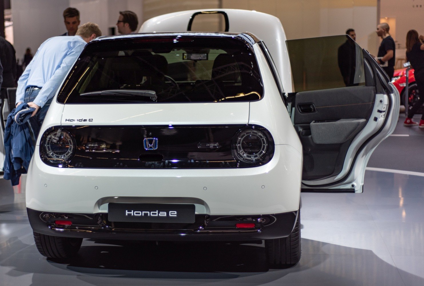 Rear view with circular taillights and open passenger door
