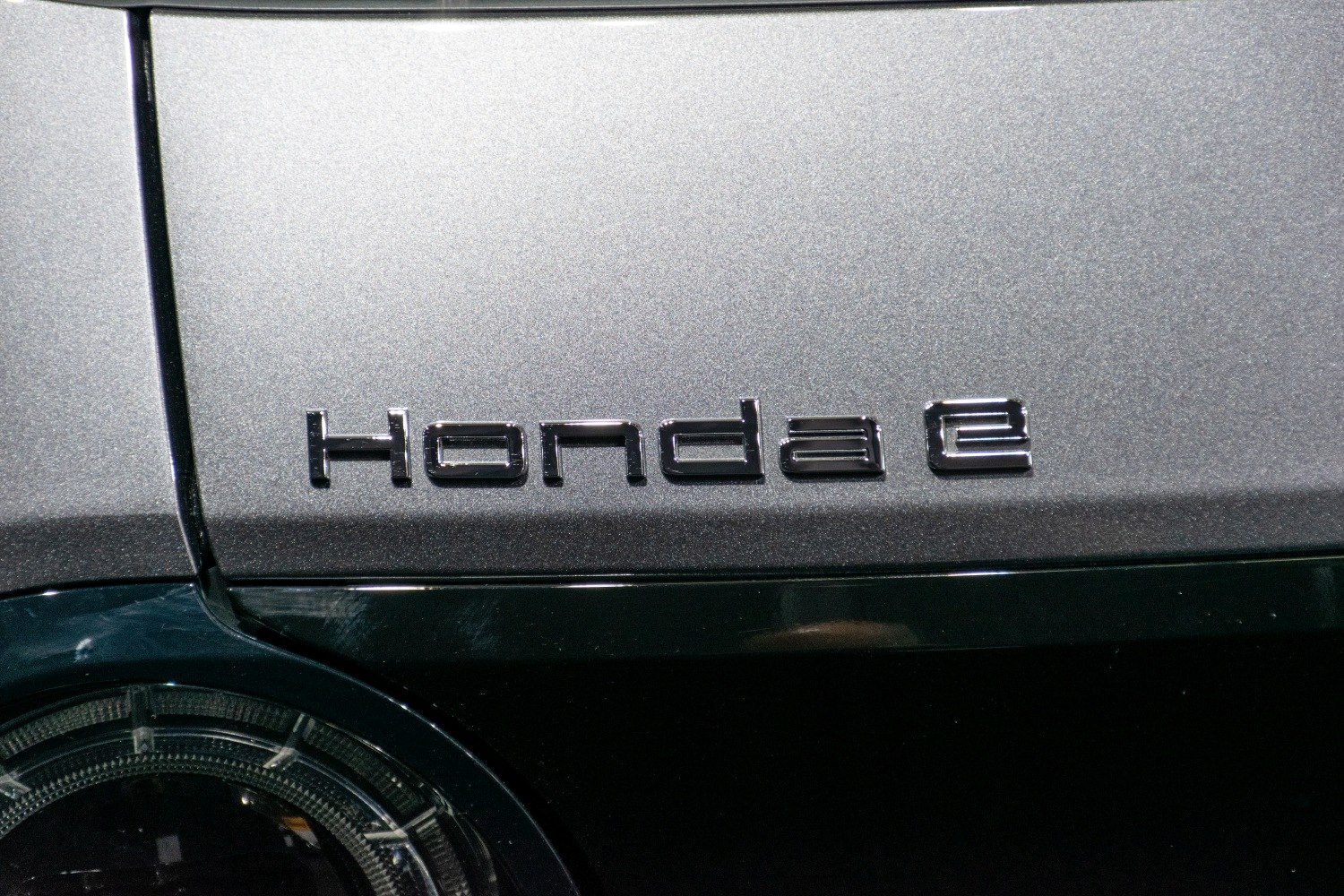 Close-up of Honda e emblem on body panel
