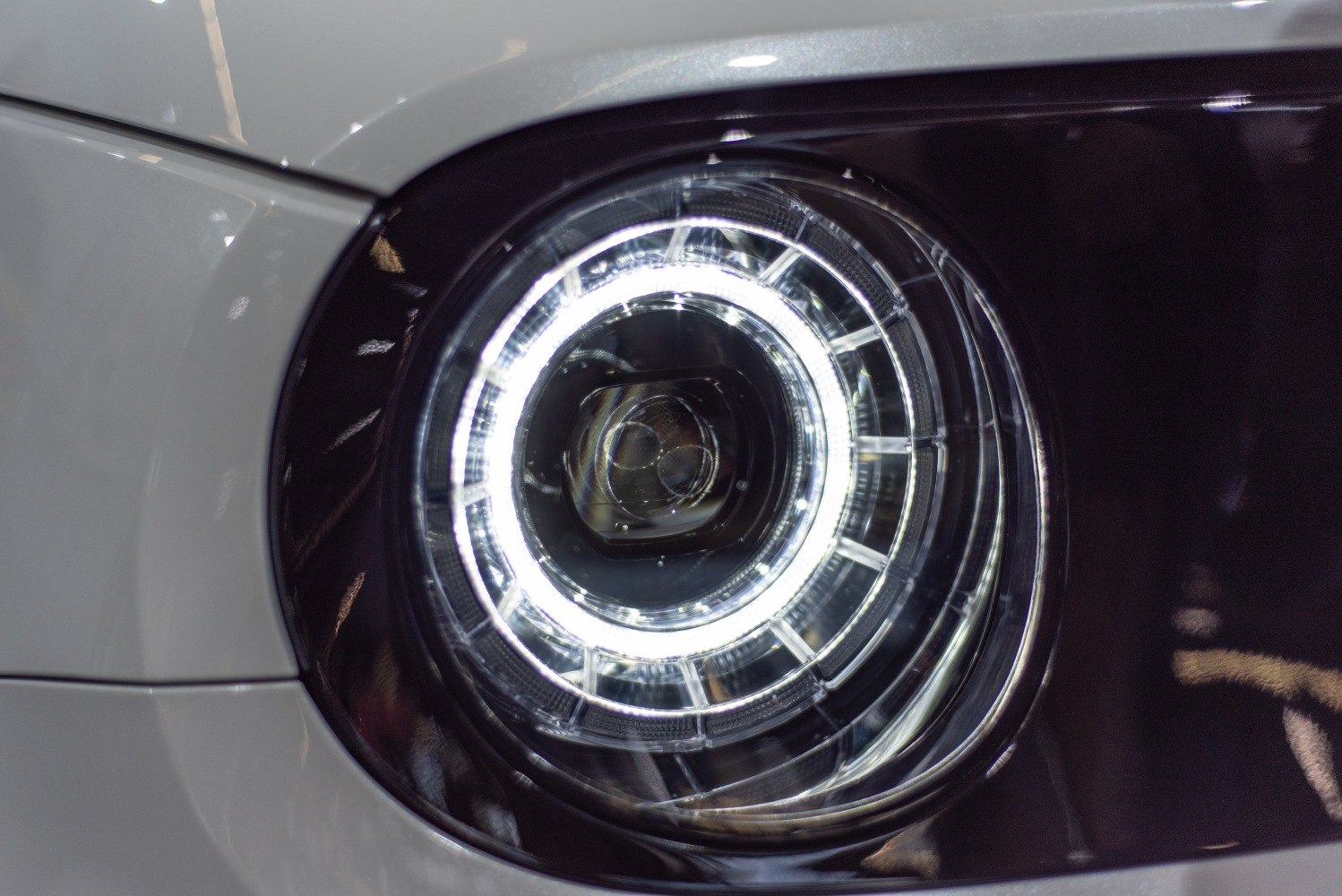 Circular LED headlight with distinct ring and modern light design