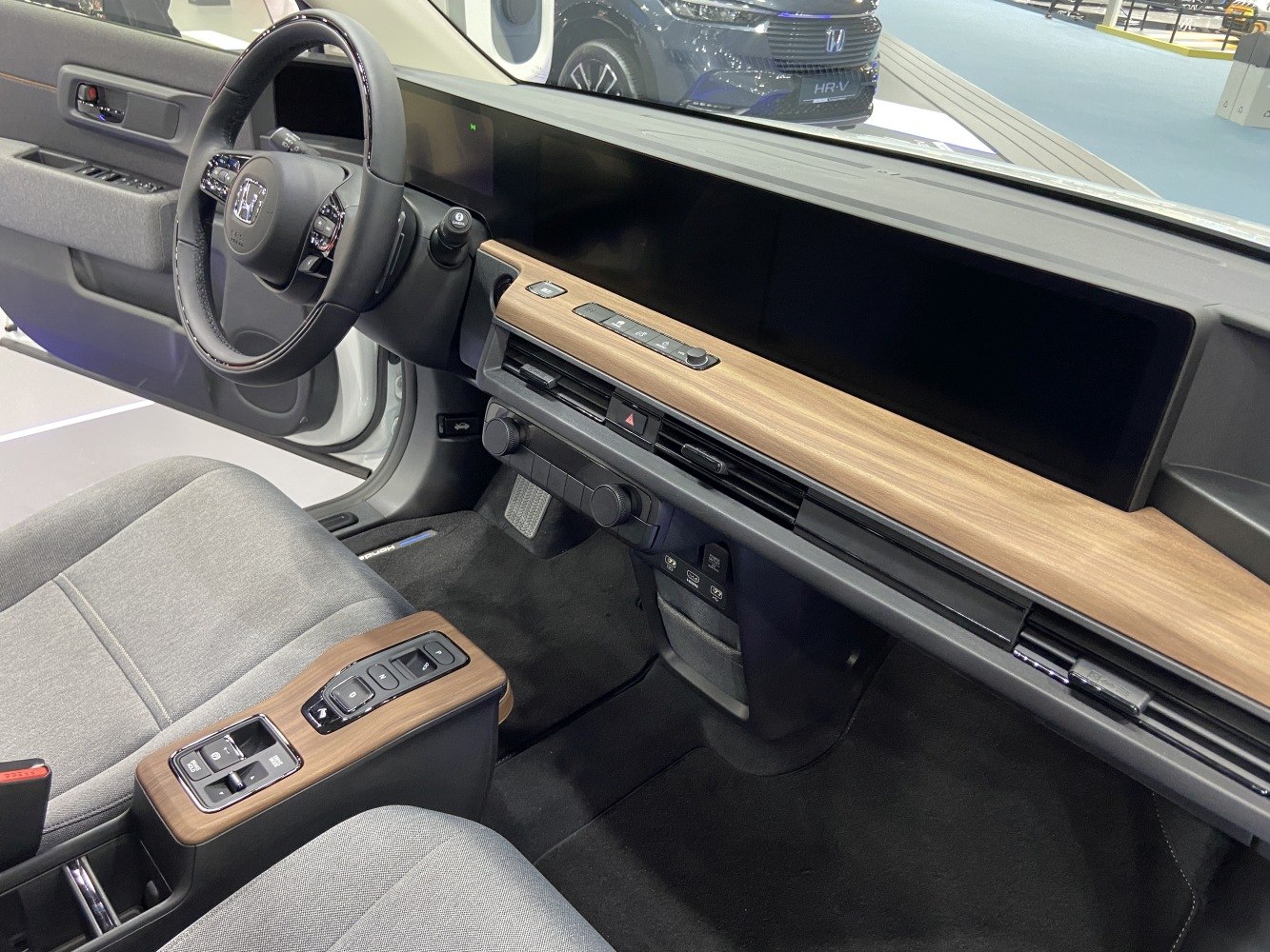 Digital dashboard with wood trim and minimalist interior design