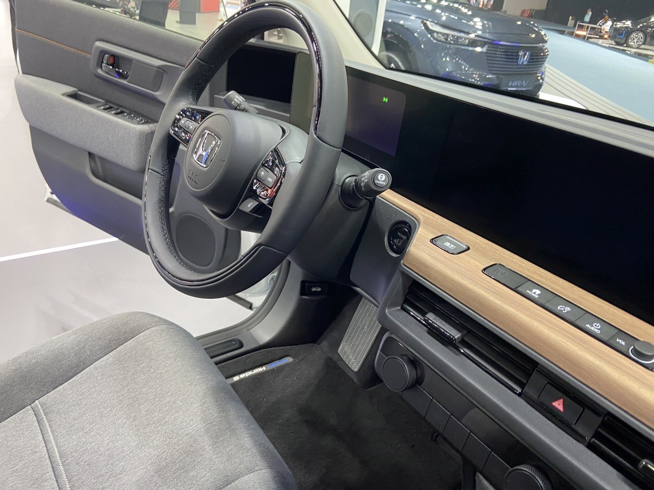 Modern digital dashboard and multifunction steering wheel with wooden trim