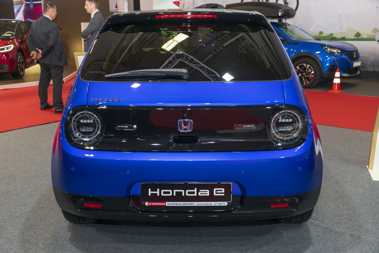Compact hatchback rear with round LED taillights and blue finish
