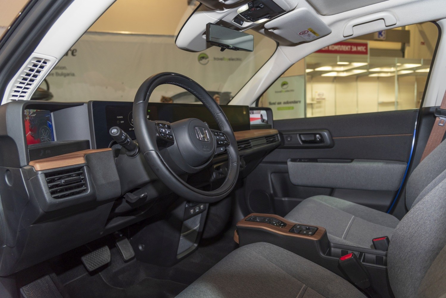 Dashboard and steering wheel with digital displays and minimalist design
