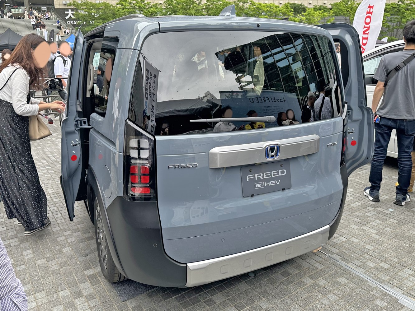 Rear view with distinctive taillights and dual rear side doors