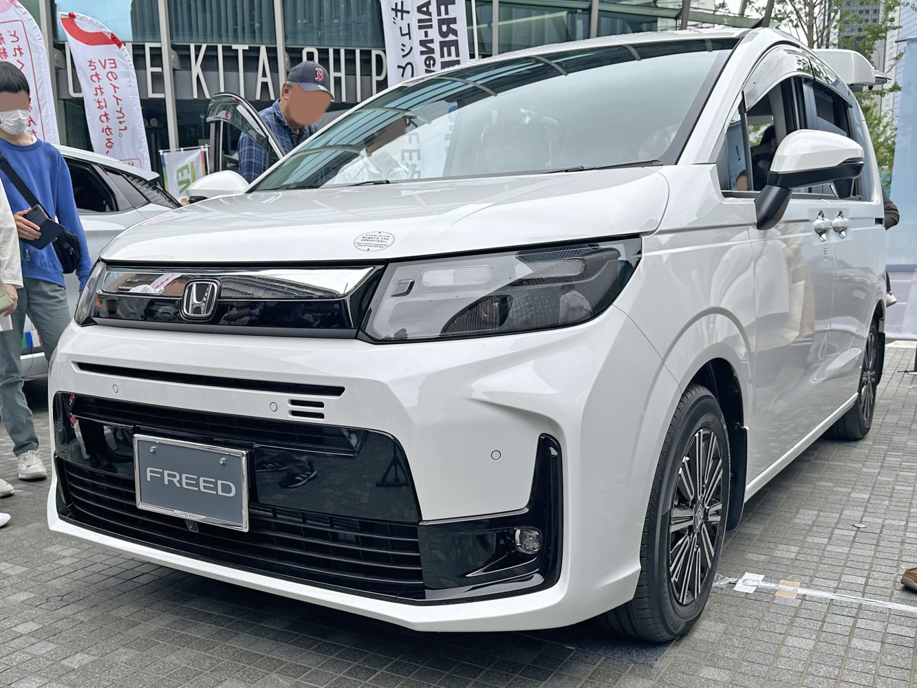 Sleek front grille with LED headlights and stylish alloy wheels.