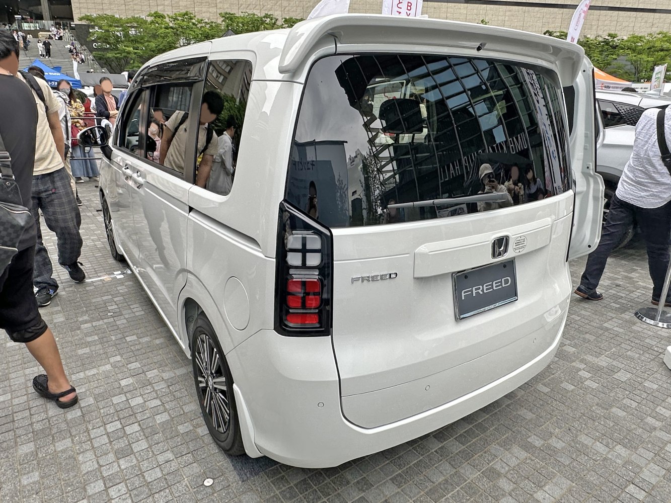 Rear view of minivan with LED tail lights and roof spoiler