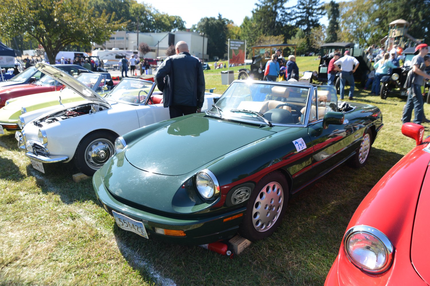 Convertible sports car with rounded headlights and alloy wheels