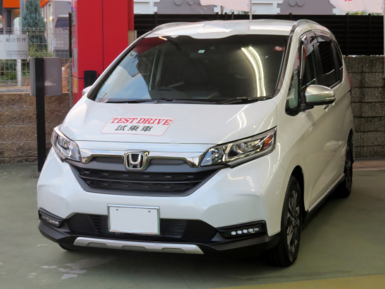 Front view showing LED headlights and bold grille design