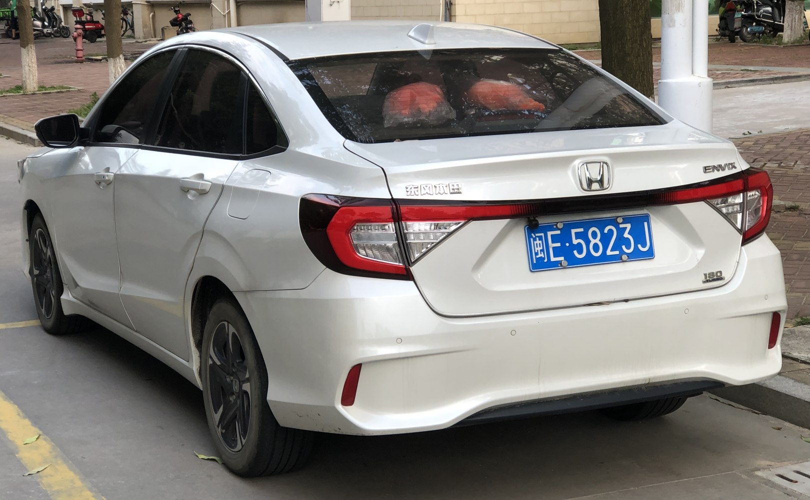Rear view featuring distinctive tail lights and rear bumper design