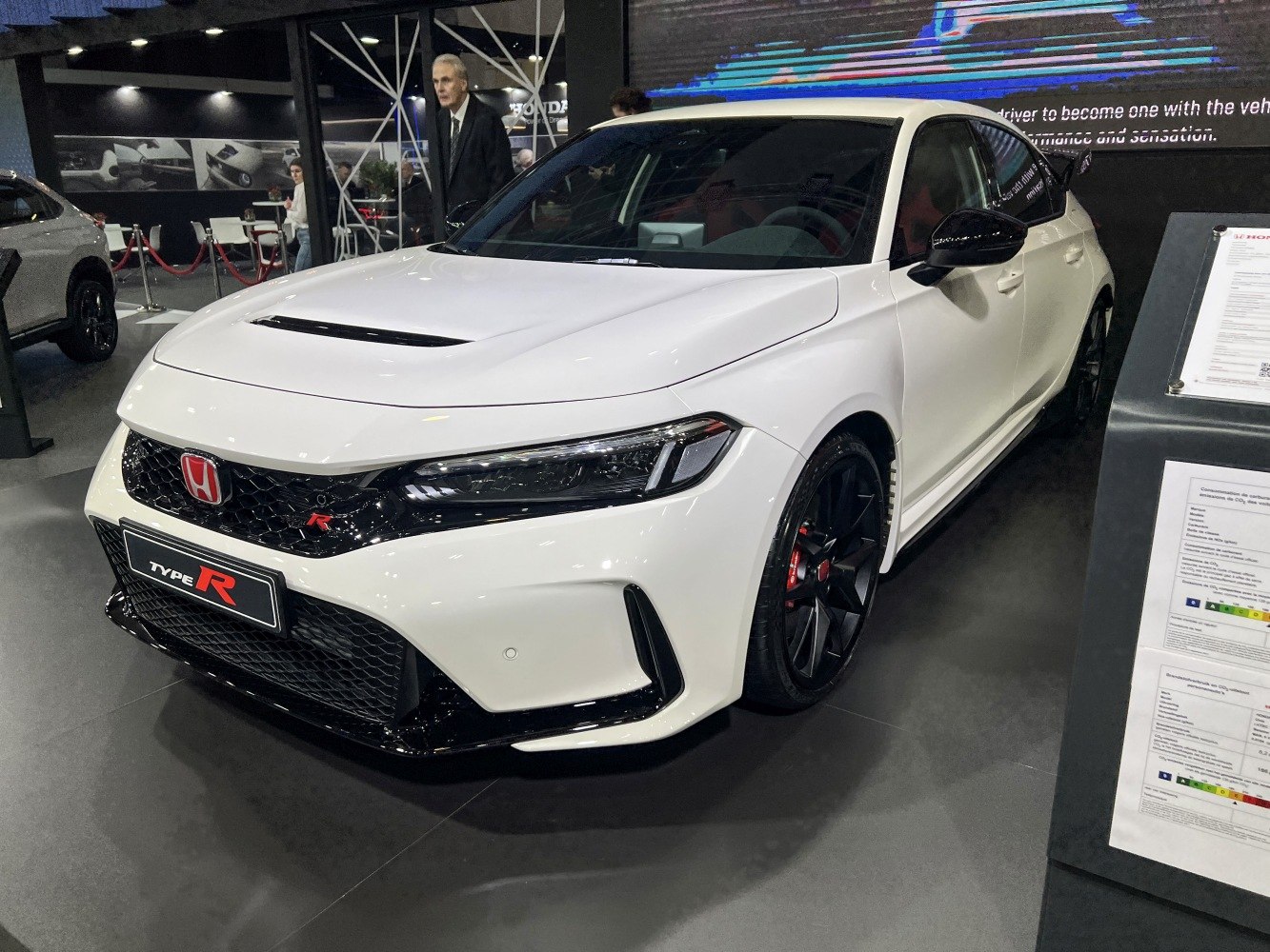 Front view of a sporty hatchback with aggressive grille and sleek headlights