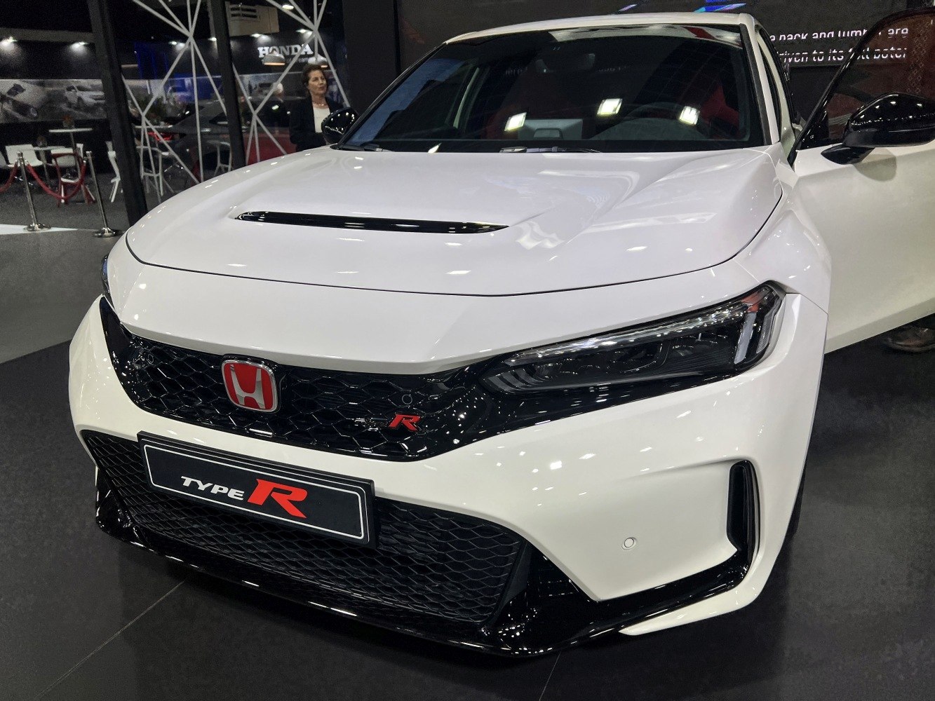 Aggressive front grille and sleek LED headlights with sporty hood vent.