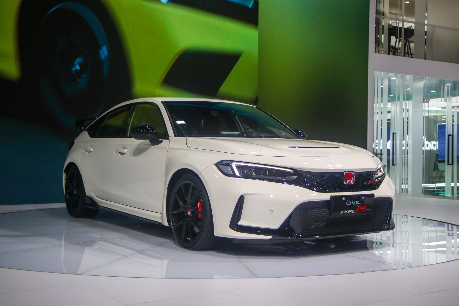 Sporty front angled view with aggressive grille and LED headlights.