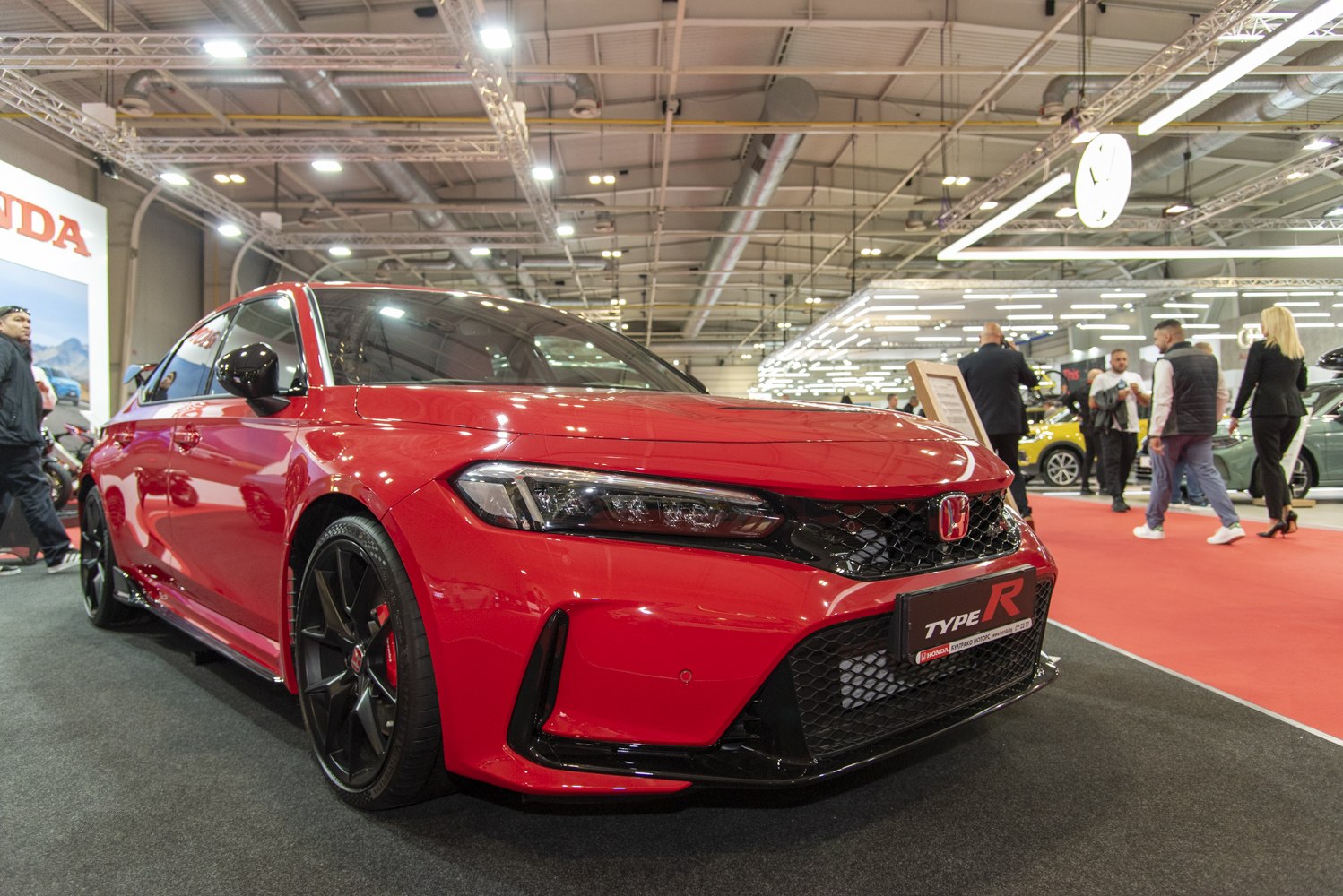 Aggressive front fascia with black grille and sporty wheels