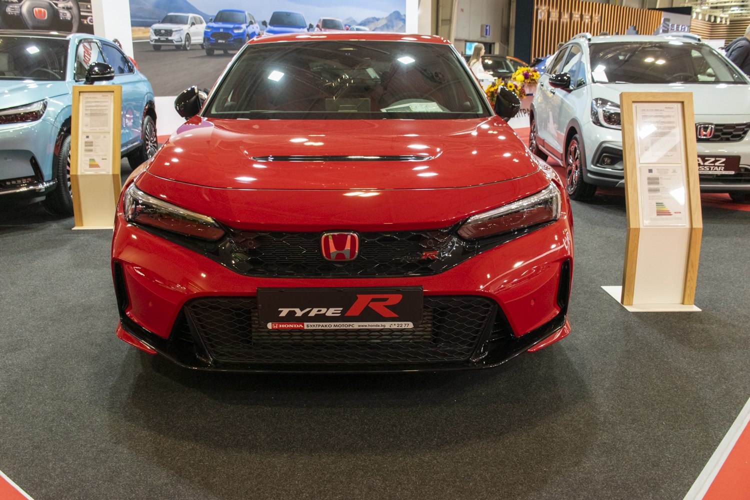 Sporty front end with grille, hood vent, aggressive styling