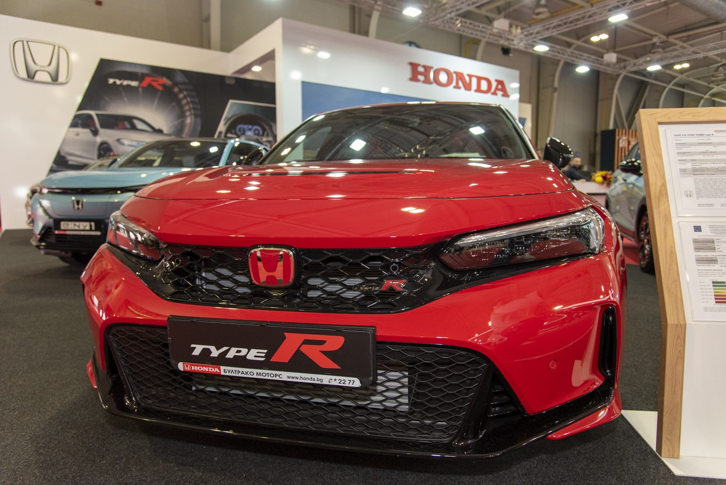 Aggressive front grille and sharp headlights of a sporty hatchback