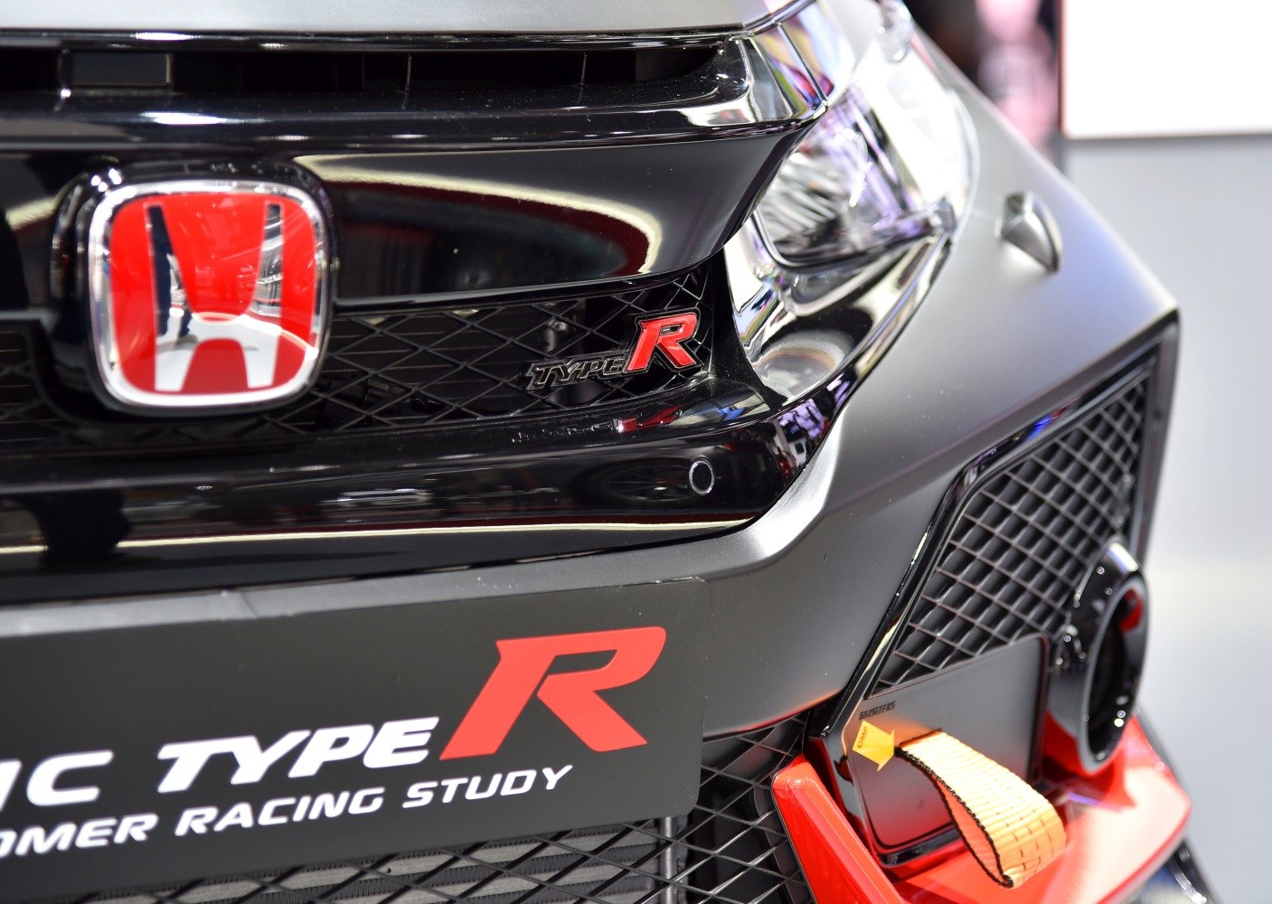 Front grille with red 'Type R' badge and tow hook on mesh grille