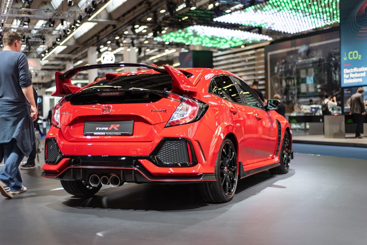 Rear view with large wing spoiler and triple exhaust tips