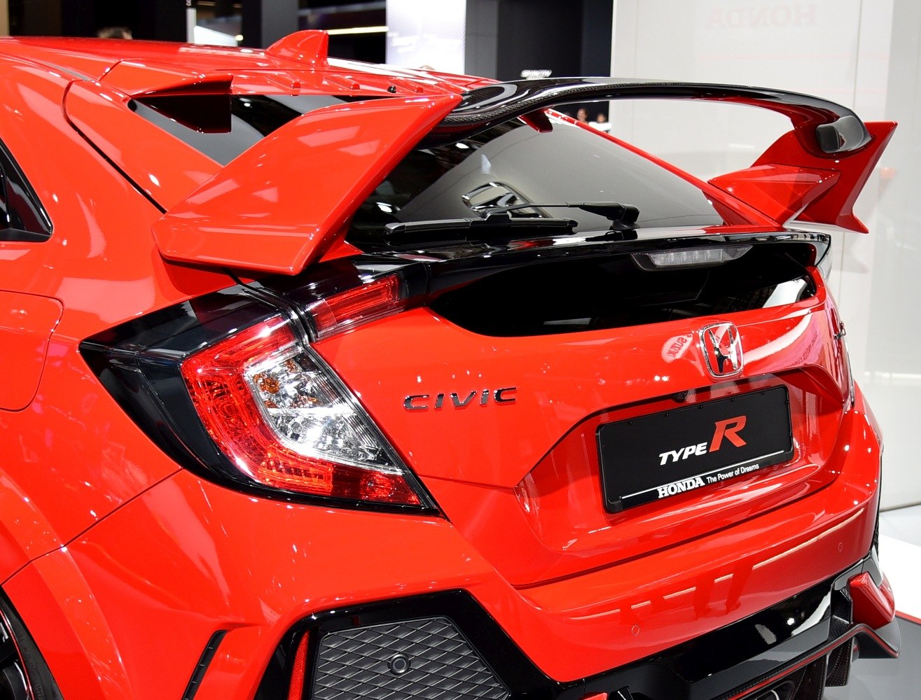 Prominent rear wing and sporty tail light assembly on rear hatchback