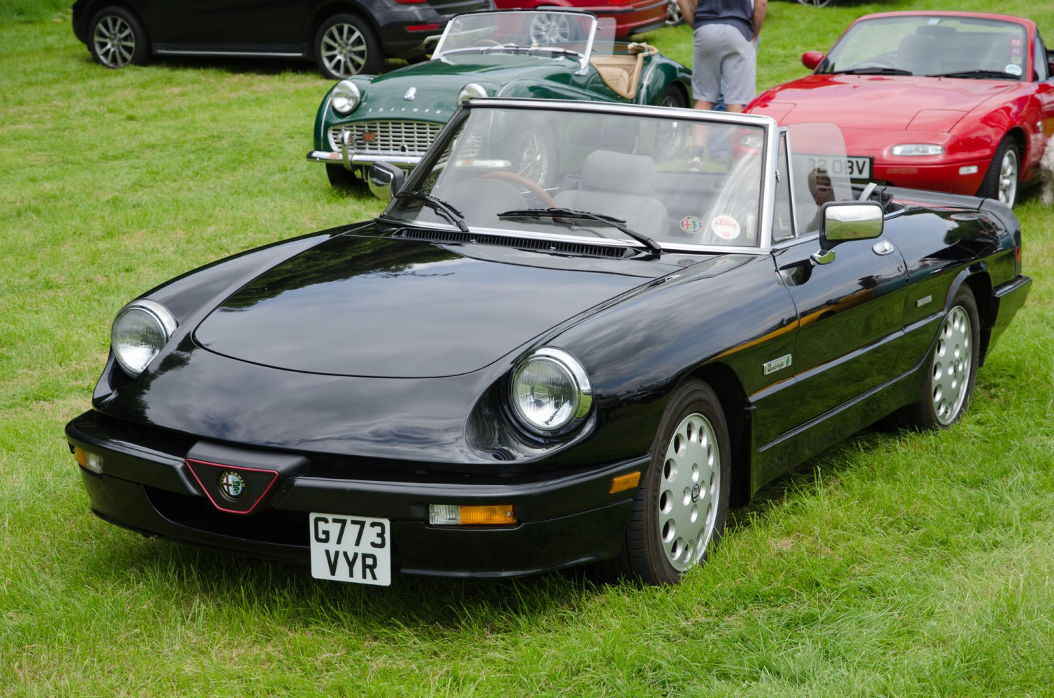 Black vintage convertible with round headlights