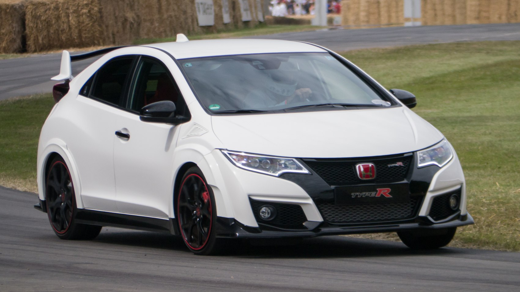 Sporty hatchback with wide fenders and spoilers