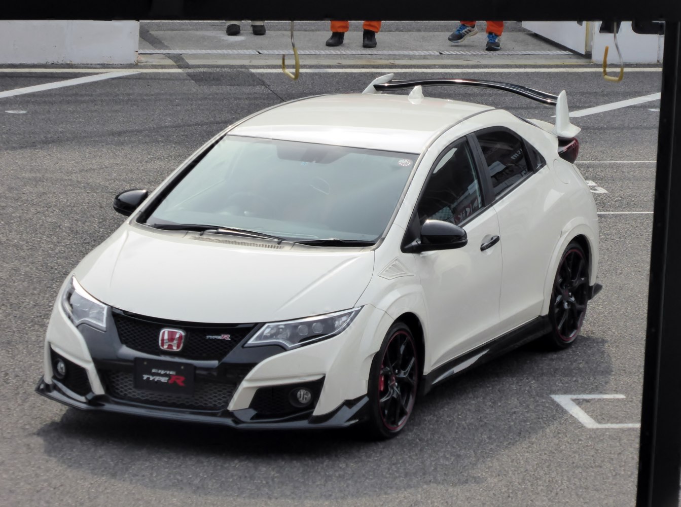 Front aerodynamic design with aggressive grille and spoiler