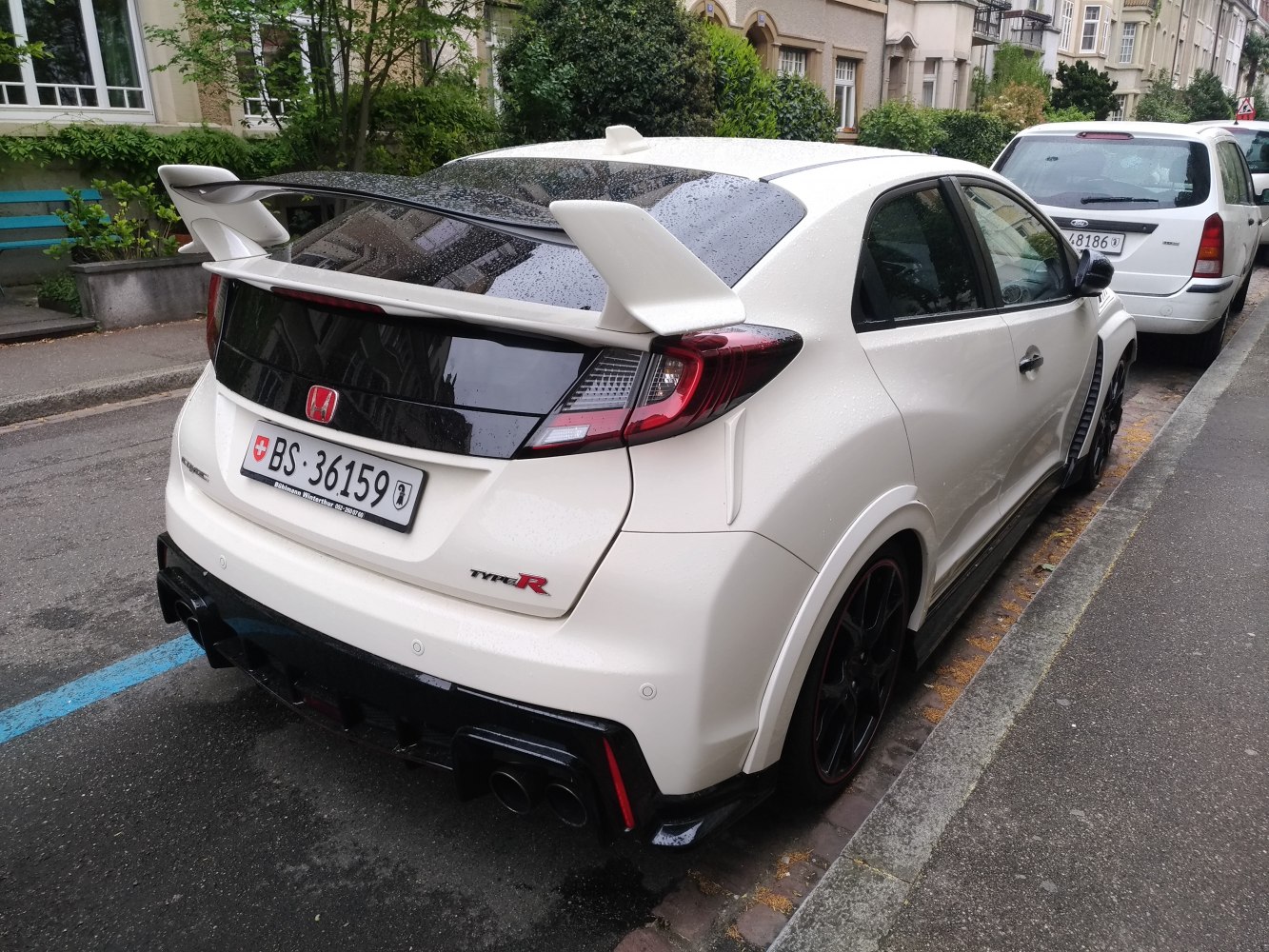 Aggressive rear design with large spoiler and quad exhaust