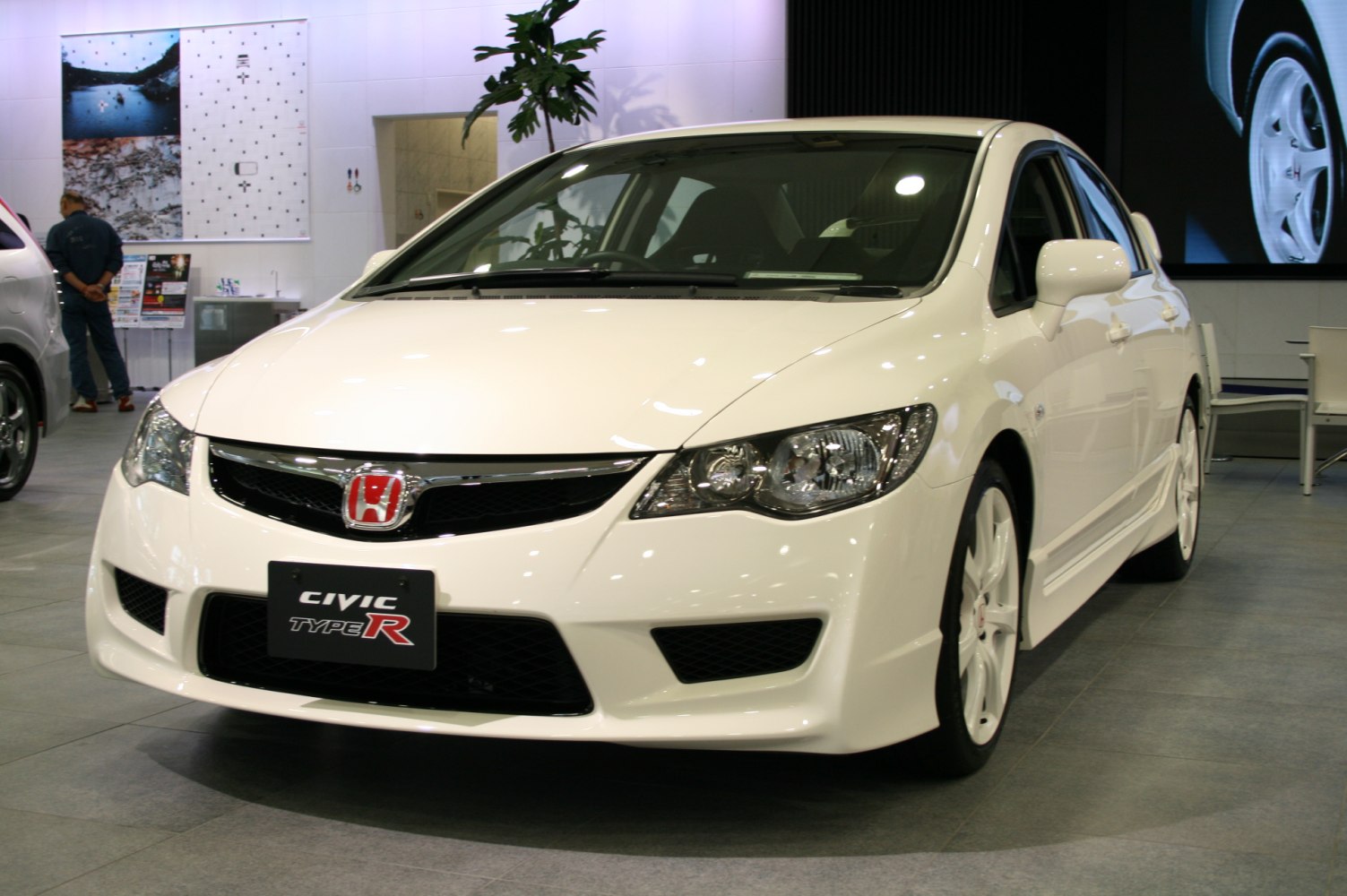 Front view with sporty headlights and aggressive grille