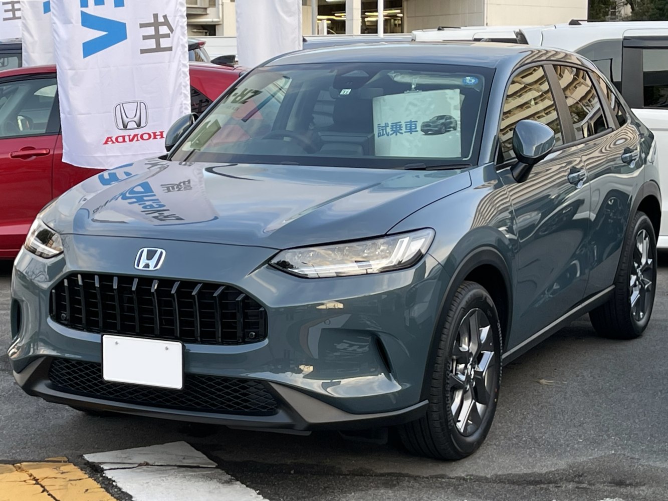 Front view of compact SUV with LED headlights and black grille