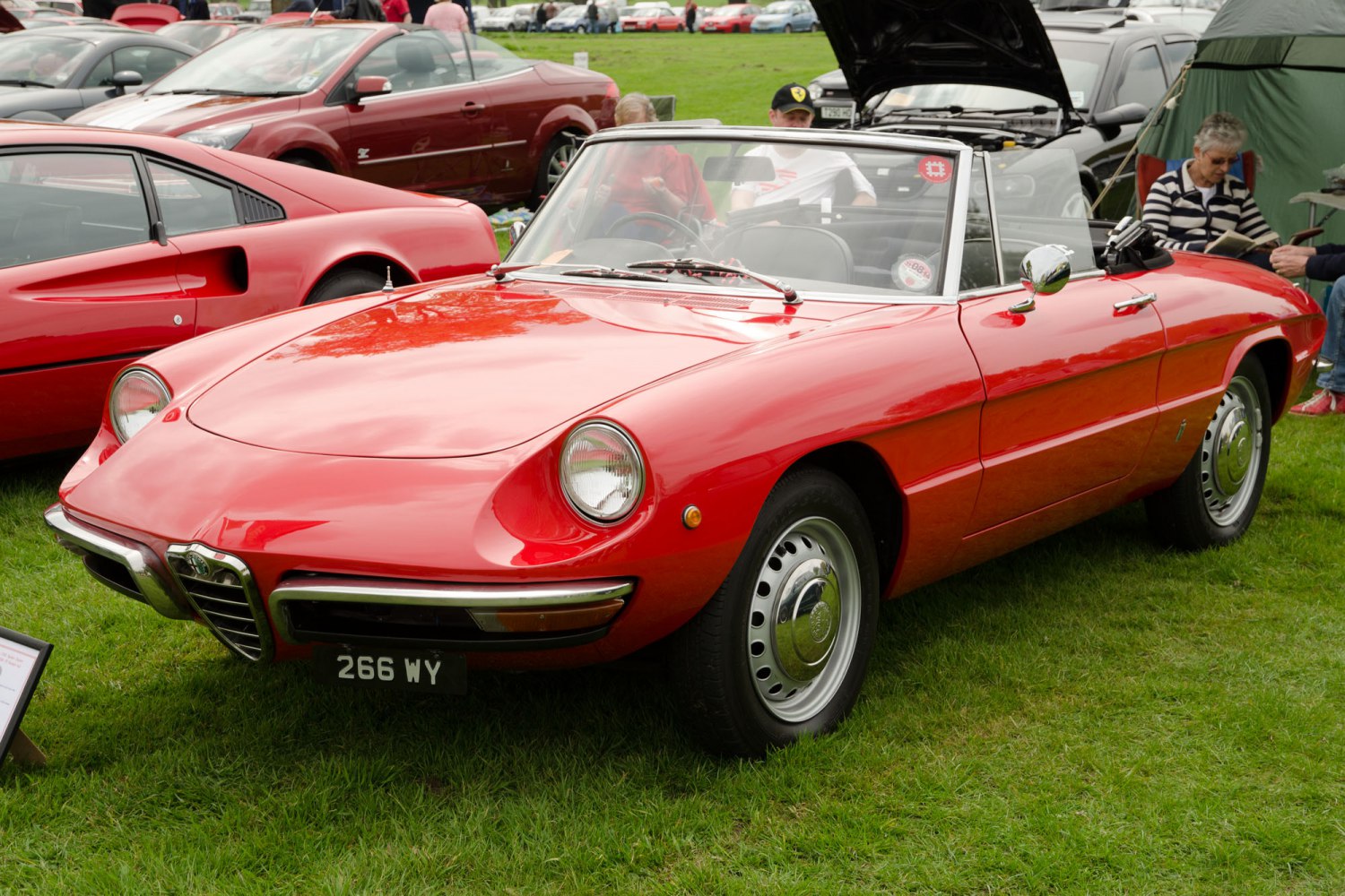 Red convertible with round headlights and chrome bumpers