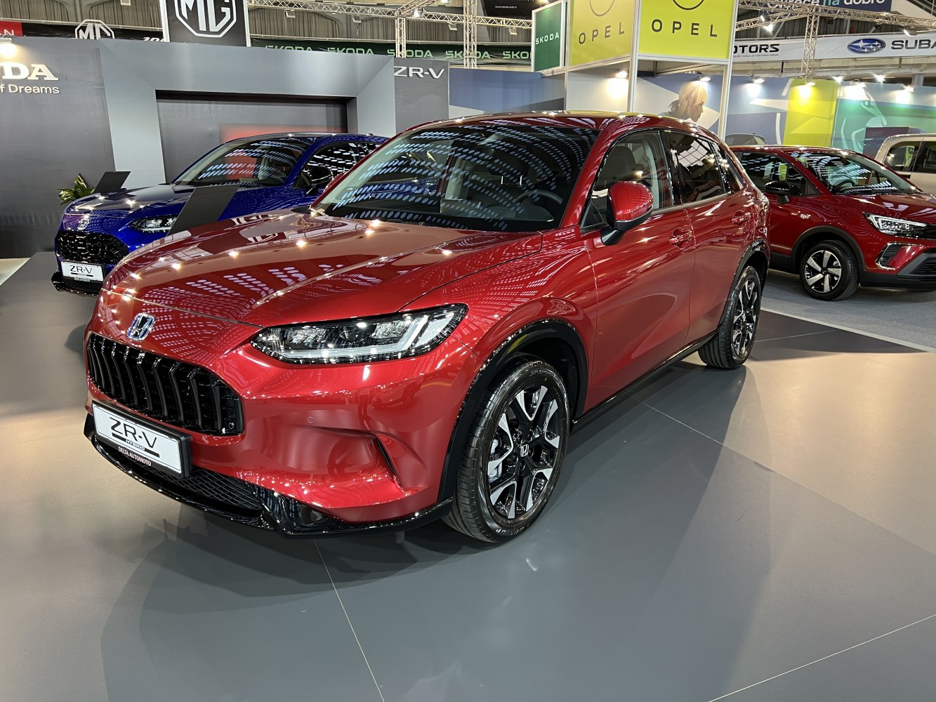 Front grille and alloy wheels of red SUV