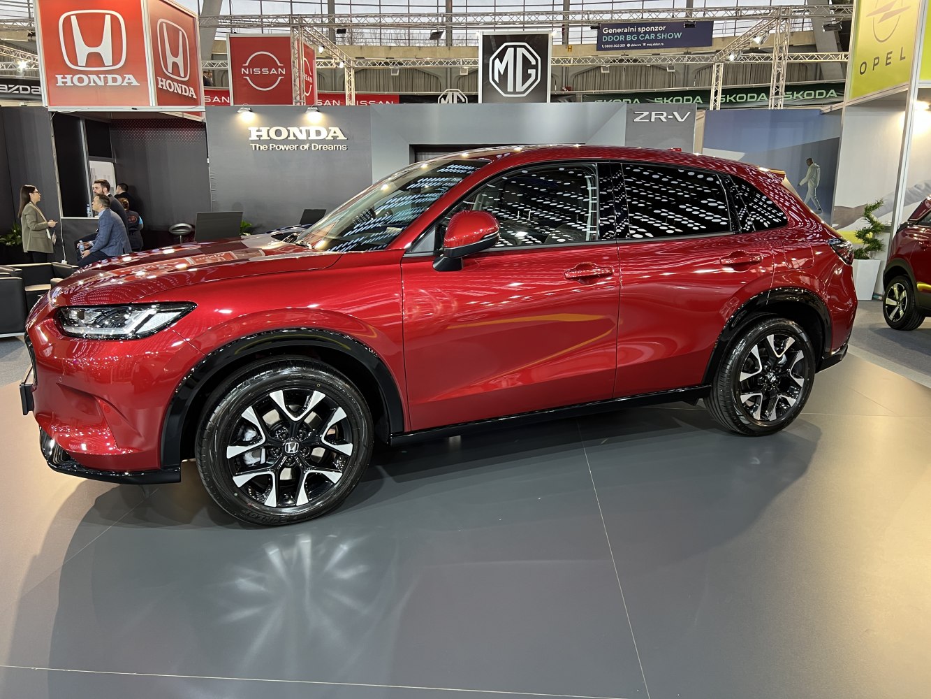 Side profile of a compact SUV with glossy alloy wheels and tinted windows