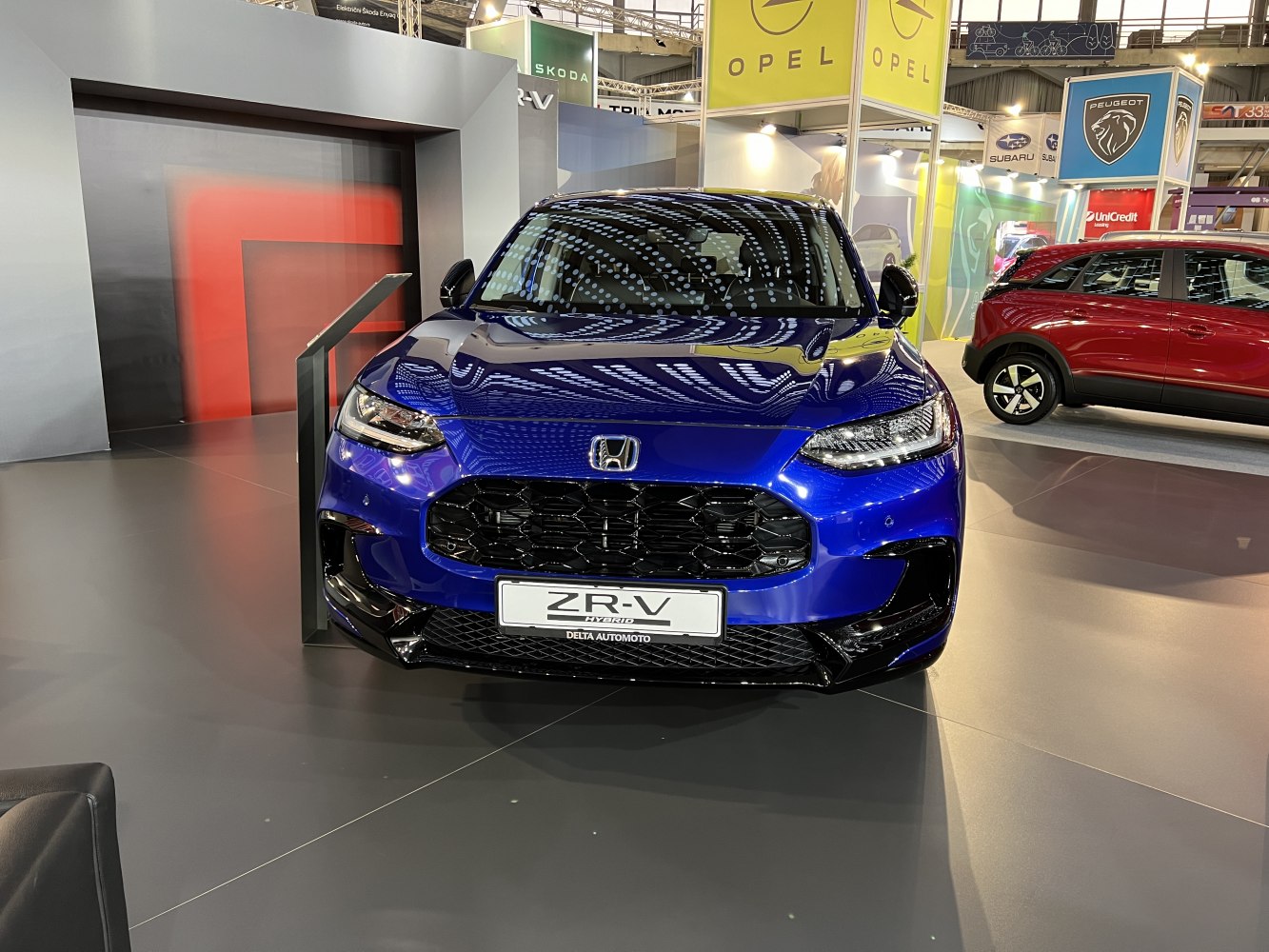 Front view with large black grille and sharp LED headlights