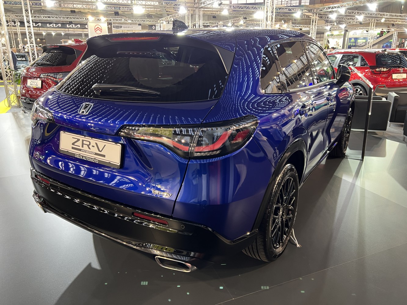 Rear view of hybrid SUV with sleek tail lights and modern design.