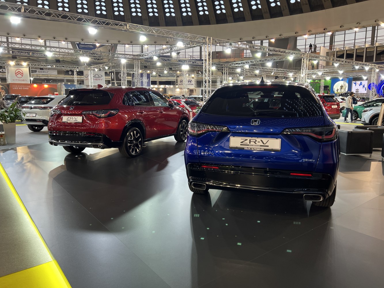 Rear view of two SUVs with dual exhaust and modern taillight design