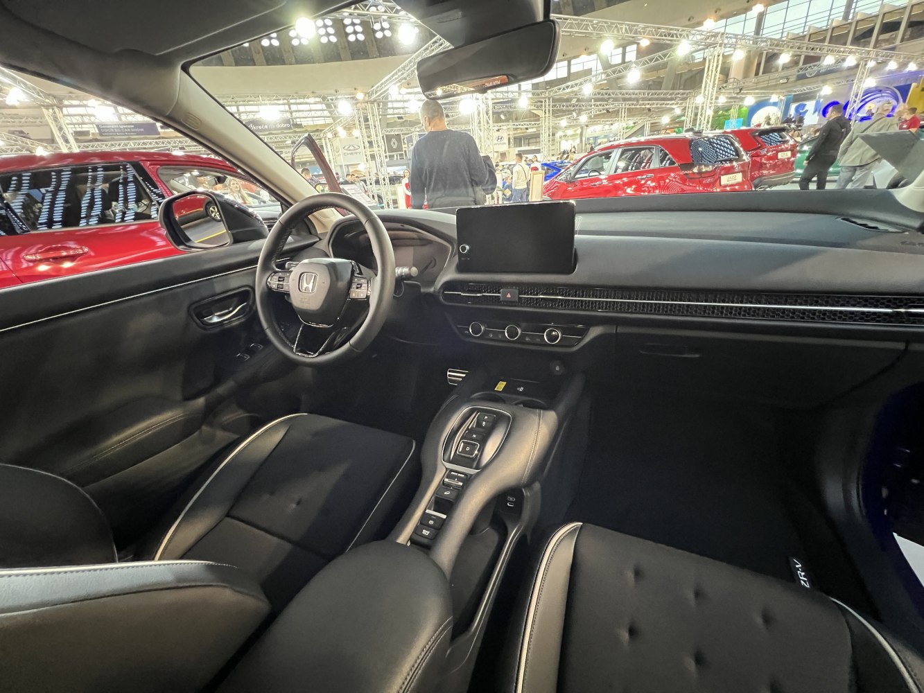Modern dashboard with multifunction steering wheel and center console gear selector