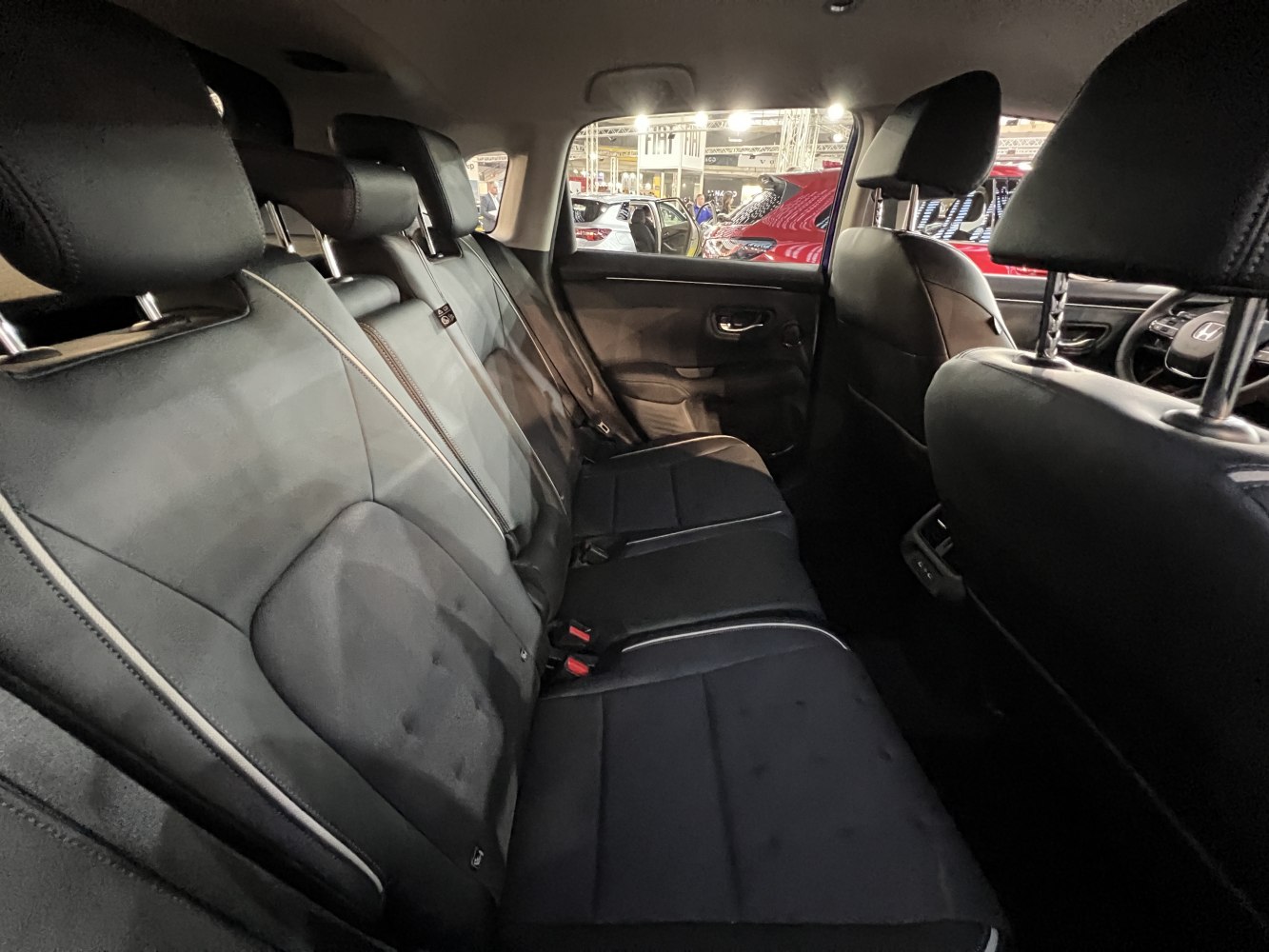 Black leather rear seats with headrests and spacious cabin