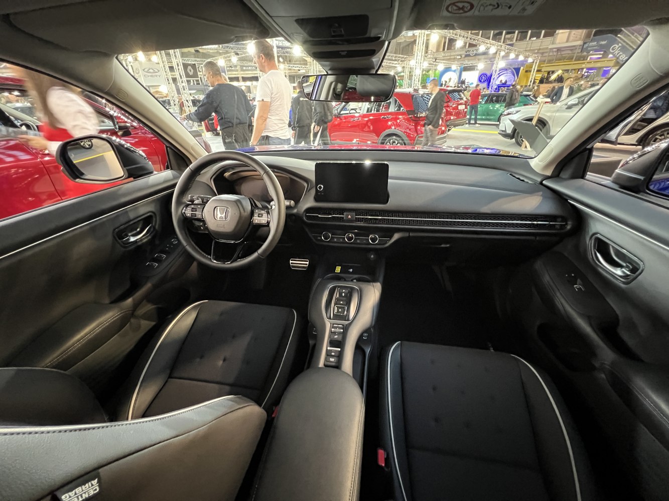 Modern car interior with steering wheel and digital display