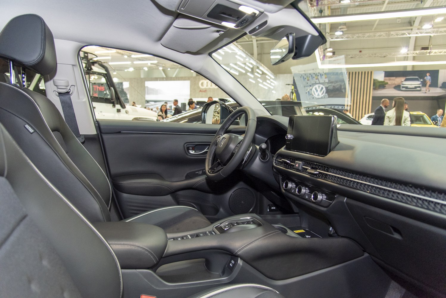 Modern car interior with touchscreen dashboard and leather seats
